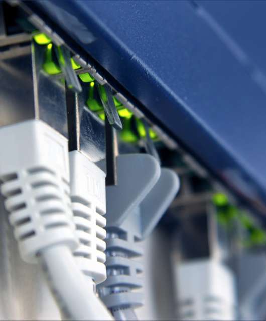 Close-up shot of cords connecting to a router.